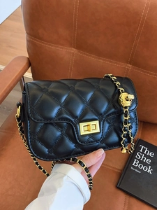 Quilted black leather shoulder bag with adjustable gold ball chain and metal lock