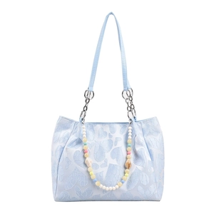 Elegant light blue tote bag featuring heart pattern texture and colorful beaded handle
