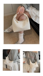 Close-up of white woven texture detail on French style hobo handbag with zip closure