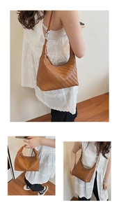 Close-up of caramel brown woven leather texture on a stylish French dumpling bag