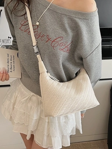 Chic beige woven crossbody bag for women with minimalist shoulder strap and metal clasp