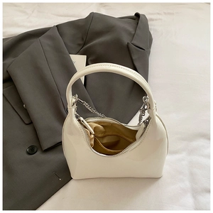 Chic cream semi-circle hobo bag with silver chain strap and zipper closure