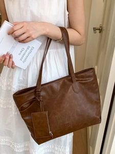 Brown soft leather tote bag with vintage texture and small hanging coin pouch for women