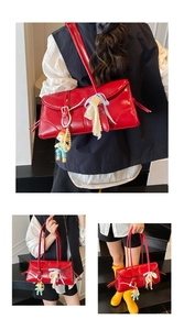 Detailed views of a red patent leather tote bag with lace ribbon and pearl charm