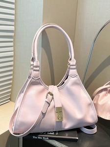 Pink minimalist tote bag with metal buckle and long handle for shoulder or hand carry