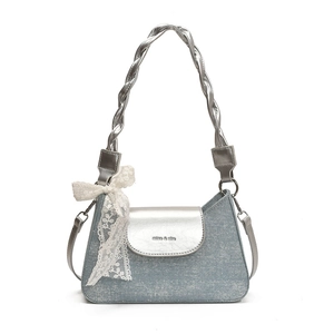 Blue denim and silver metallic leather shoulder bag with woven handle and lace bow