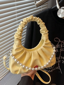 Chic yellow pleated cloud bag with elegant pearl chain and detachable shoulder strap