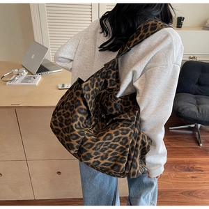Detail of the large leopard print canvas tote bag with spacious interior for daily use
