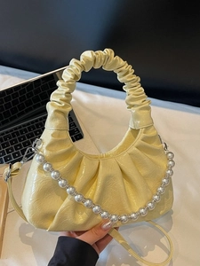 Light yellow pleated cloud bag with glossy PU leather and large pearl chain detail