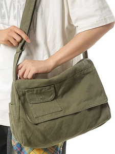Olive green large canvas messenger bag with adjustable strap and front pocket