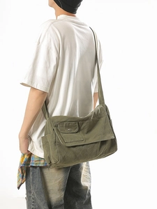 Army green canvas messenger bag in large capacity minimalist style for men and women