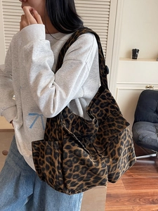 Stylish large leopard print canvas tote bag for women with dual front pockets and wide strap