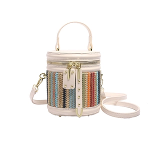Chic multi-color striped straw bucket bag with gold studs and dual-zipper cylindrical shape