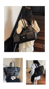 Detailed view of black large capacity tote bag with side buckles and matching inner pouch