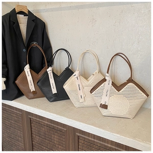 Detail of four hollow tote bags in various colors with decorative silk scarves