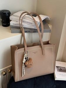 Large khaki tote bag in pebble leather with stitch detail and plush bear charm