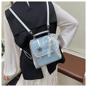 Blue glitter backpack with lace pearl bow and star buckle shown on person