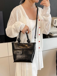 Retro black crocodile embossed handbag with multiple pockets and knot handle detail