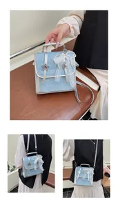 Detailed views of light blue glitter handbag with star buckles and pearl lace bow charm