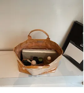 Top view of large waterproof PVC tote bag showing spacious interior and laptop storage