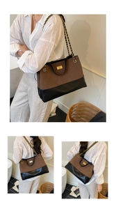 Dettaglio borsa tote vintage marrone e nera con cuciture a rombi e catena in metallo oro