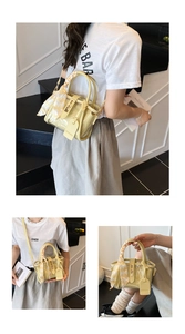 Detail of yellow transparent PVC bucket bag with inner pouch and checkered silk scarf handle