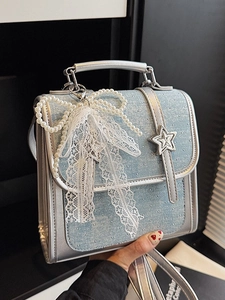 Chic silver and blue patchwork handbag with pearl bow and star detail for women