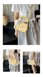 Detail view of yellow checkered handbag featuring a lace bow and crossbody strap