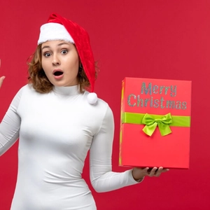 Slim fit white long sleeve turtleneck top for Christmas with a festive red background