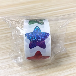 Macro detail of laser starry stickers in rolls showing shimmering glitter and holographic finish