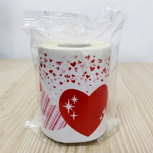 Detail of Valentine heart border stickers on a roll with red stars and pink stripes