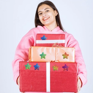 Close-up of holographic star stickers on gift boxes for decoration and rewards