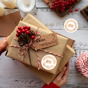 500pcs Gold Foil Christmas Wreath Stickers on a Gift Box with Festive Holiday Decorations