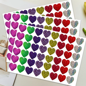 Multicolor heart glitter stickers set on desk for gift wrapping and DIY decor