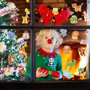 Close-up of cartoon forest animal window stickers on glass with a warm home background