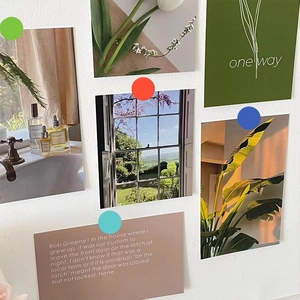 Close-up of decorative wall art cards set with assorted colorful round adhesive dots