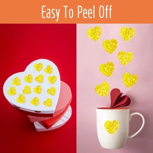 Detail of glitter gold heart stickers applied on gift boxes and a ceramic mug decoration