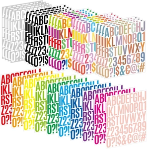 Macro view of colorful capital letters and numbers stickers set on white background