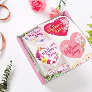 Detail of heart-shaped Mother's Day floral stickers in a gift box with carnations