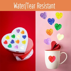 Detail of waterproof glitter heart stickers applied to a gift box and white ceramic mug