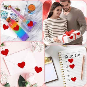 Detail showing red glitter heart stickers on gift boxes, envelopes and glass jars