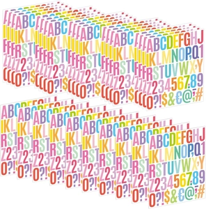 Close-up of vibrant multi-page colorful alphabet, numbers and symbols DIY sticker sheets