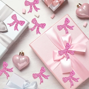 Roll of 500 pink glitter bow stickers for decorative gift sealing and office stationery