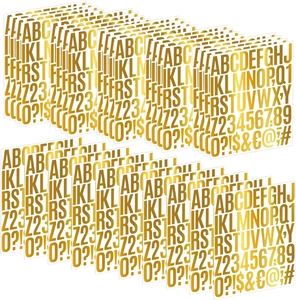 Close-up of golden metallic alphabet and number stickers set for DIY crafts