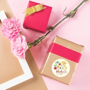 Floral Happy Mother's Day stickers on gift boxes with pink carnations and elegant backdrop