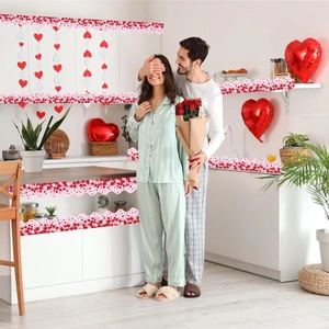 Valentine heart border stickers and hanging garlands decorating a kitchen for romantic events