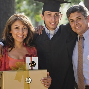 Close-up of gold Congrats Grad seal on a gift box for graduation celebration events