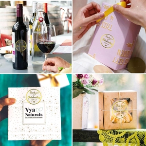 Detailed application of gold foil Thank You stickers on gift boxes and bottles