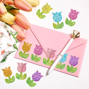Detailed view of colorful laser glitter tulip stickers sealing a pink envelope decoration