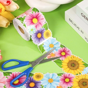 Floral bulletin board border sticker roll with daisies and scissors for DIY crafts